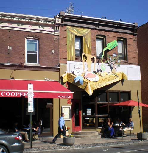 Figure 8. The first upscale restaurant on Main Street was 'Jamies' (1986) which served French Cuisine and was closed by the early 90s. The photo shows 'Jakes' which opened in 1987 incorporating an electric menu and façade. Jakes is still open and has recently opened a wine bar and small plate bistro next store called 'Coopers'. 